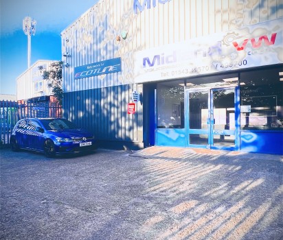 Blue Volkswagen golf parked outside of Midland VW unit
